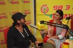 Jacqueline Fernandez & Arjun Rampal at Radio Mirchi Mumbai studio for the promotion of Roy (3)_54acc7015e48d.JPG