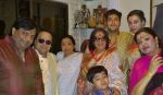 Govind Bansal, Bappi Lahiri, Asha Bhosle, Bappa Lahiri, Chitrani Lahiri, Tanisha Lahiri, Rema Bansal & kid Swastik Lahiri at Bappi Lahiri_s Saraswati Puja_54c612c975fa3.jpg