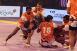 Jang Kun Lee (Bengal Warriors) attempts to get out of the Puneri Paltan defence hold_55ba0c54a5ba6.jpg