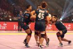 Wazir Singh (Puneri Paltan) is lifted off the ground by the Bengal Warriors defence in a successful tackle_55ba0c6484a06.jpg