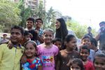  Poonam Pandey Distribute Raincoat To Neddy Kids on 30th May 2017 (17)_592ebef64775b.JPG