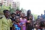  Poonam Pandey Distribute Raincoat To Neddy Kids on 30th May 2017 (23)_592ebf01ee53e.JPG