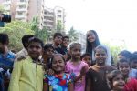  Poonam Pandey Distribute Raincoat To Neddy Kids on 30th May 2017 (27)_592ebf083fc8a.JPG