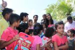  Poonam Pandey Distribute Raincoat To Neddy Kids on 30th May 2017 (66)_592ebf537a3dd.JPG