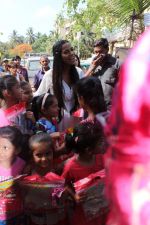  Poonam Pandey Distribute Raincoat To Neddy Kids on 30th May 2017 (85)_592ebf7c49610.JPG