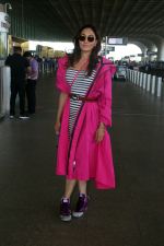 Khushali Kumar wearing a stylish pink coat and sunglasses in a pair of purple high top sneakers (1)_646f31db3646a.jpg