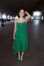 Nushrratt Bharuccha in shoulderless green dress with a tie knot wearing dark shades (5)_646f4938c709f.jpg