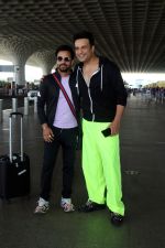 Krushna Abhishek in a black laced coat and fluorescent green pants and black sneakers (7)_64718d9974def.jpg