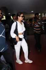 Malaika Arora in white wearing dark glasses white sneakers and holding black Chanel Bag  (1)_64744743898b2.jpg