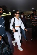 Malaika Arora in white wearing dark glasses white sneakers and holding black Chanel Bag  (12)_6474474a27f42.jpg