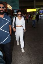 Malaika Arora in white wearing dark glasses white sneakers and holding black Chanel Bag  (2)_6474473daf869.jpg