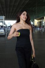 Nikki Tamboli wearing all black strapless bodycon dress, white sneakers holding Tamboli holding Chanel Black Quilted Lambskin Small Trendy Top Handle Flap Bag (14)_64746e15cedfc.jpg