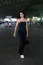 Nikki Tamboli wearing all black strapless bodycon dress, white sneakers holding Tamboli holding Chanel Black Quilted Lambskin Small Trendy Top Handle Flap Bag (17)_64746e289ad53.jpg