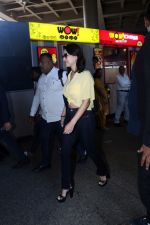 Sunny Leone is dressed in a yellow shirt blue jeans sunglasses and black high heels (26)_647423ca6ed60.jpg