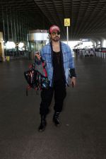 Gautam Gulati holding Christian Louboutin Explorafunk Backkpack dressed in Black with a red cap and blue jacket (2)_6475d835845f7.jpg