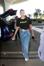 Athiya Shetty wearing black FCUK Logo crop top, Michellecmm high waist baggy blue jeans tagging Goyard Canvas Leather Purse (2)_6478719e31a23.jpg
