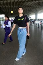 Athiya Shetty wearing black FCUK Logo crop top, Michellecmm high waist baggy blue jeans tagging Goyard Canvas Leather Purse (5)_6478719a30079.jpg