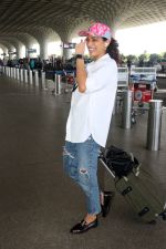 Kubbra Sait in white shirt jeans pant, pink cap wearing Aldo Valenaclya chain loafers in black patent