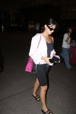 Nora Fatehi dressed in black top skin tight pant and light pink pullover at the airport on 13 Jun 2023 (8)_6488a3d4b4462.jpg