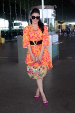Urvashi Rautela dressed in a pink and orange floral dress spotted at airport on 14 Jun 2023 (11)_6489cf8919708.jpg