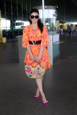Urvashi Rautela dressed in a pink and orange floral dress spotted at airport on 14 Jun 2023 (12)_6489cf89d944f.jpg