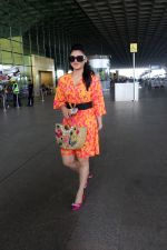 Urvashi Rautela dressed in a pink and orange floral dress spotted at airport on 14 Jun 2023 (5)_6489cf78ec6c9.jpg