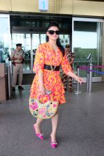 Urvashi Rautela dressed in a pink and orange floral dress spotted at airport on 14 Jun 2023 (6)_6489cf7cc52ce.jpg