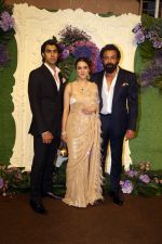 Bobby Deol with wife Tanya and son Aryaman Pose for media at the reception of Karan Deol and Drisha Acharya on 18 Jun 2023 (22)_6490677048cdb.jpeg