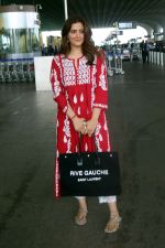 Nupur Sanon seen shinnig in red at the airport holding Saint Laurent handbag on 9 July 2023 (10)_64ac091130caf.jpg