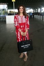 Nupur Sanon seen shinnig in red at the airport holding Saint Laurent handbag on 9 July 2023 (5)_64ac090c52c96.jpg