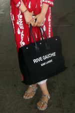 Nupur Sanon seen shinnig in red at the airport holding Saint Laurent handbag on 9 July 2023 (6)_64ac090d9fe4a.jpg
