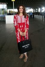 Nupur Sanon seen shinnig in red at the airport holding Saint Laurent handbag on 9 July 2023 (7)_64ac090e7b191.jpg