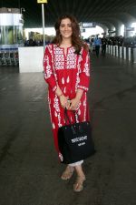 Nupur Sanon seen shinnig in red at the airport holding Saint Laurent handbag on 9 July 2023 (8)_64ac090f676a8.jpg