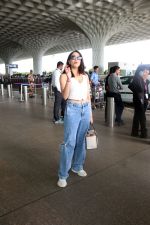 Sharvari Wagh dressed in white sleeveless top and blue jeans seen at the airport on 11 July 2023 (3)_64acd9e308452.JPG