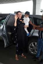 Kajal Aggarwal with her son Neil Kitchlu Spotted at the Airport Departure on 17th August 2023 (1)_64ddd26d098a7.JPG