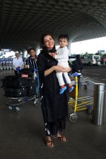 Kajal Aggarwal with her son Neil Kitchlu Spotted at the Airport Departure on 17th August 2023 (16)_64ddd29ff02f9.JPG
