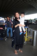 Kajal Aggarwal with her son Neil Kitchlu Spotted at the Airport Departure on 17th August 2023 (17)_64ddd2a3cecf4.JPG