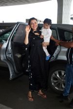 Kajal Aggarwal with her son Neil Kitchlu Spotted at the Airport Departure on 17th August 2023 (2)_64ddd26fa5b2e.JPG