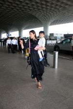 Kajal Aggarwal with her son Neil Kitchlu Spotted at the Airport Departure on 17th August 2023 (20)_64ddd2adb429b.JPG
