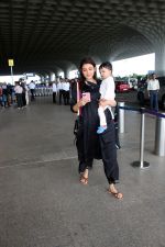 Kajal Aggarwal with her son Neil Kitchlu Spotted at the Airport Departure on 17th August 2023 (23)_64ddd2b9bf5a2.JPG