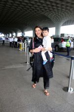 Kajal Aggarwal with her son Neil Kitchlu Spotted at the Airport Departure on 17th August 2023 (26)_64ddd2c5236ab.JPG