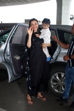 Kajal Aggarwal with her son Neil Kitchlu Spotted at the Airport Departure on 17th August 2023 (27)_64ddd2697e3c0.JPG