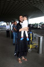 Kajal Aggarwal with her son Neil Kitchlu Spotted at the Airport Departure on 17th August 2023 (7)_64ddd27f3576d.JPG
