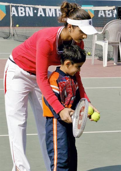 Sania Mirza coaches a kid on the opening day of the ABN AMRO Tennis Challenge