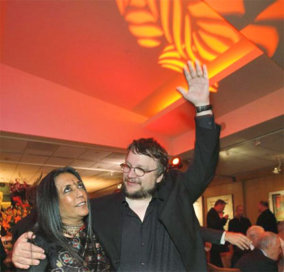 Mexican director Guillermo Del Toro gestures with Deepa Mehta