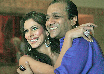 Pooja Bedi embraces quizmaster Siddhartha Basu