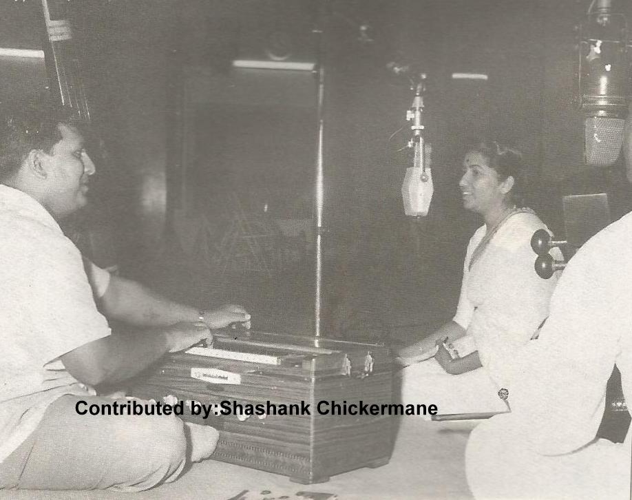 Lata recording a song with Shankar in the recording studio