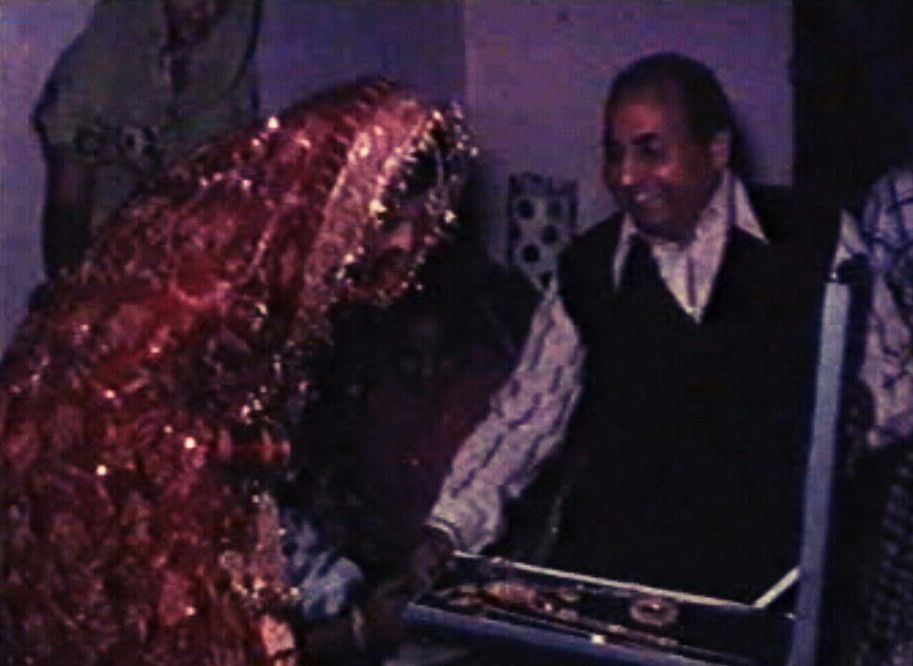 Mohdrafi presents a gift to his daughter-in-law in the wedding ceremony