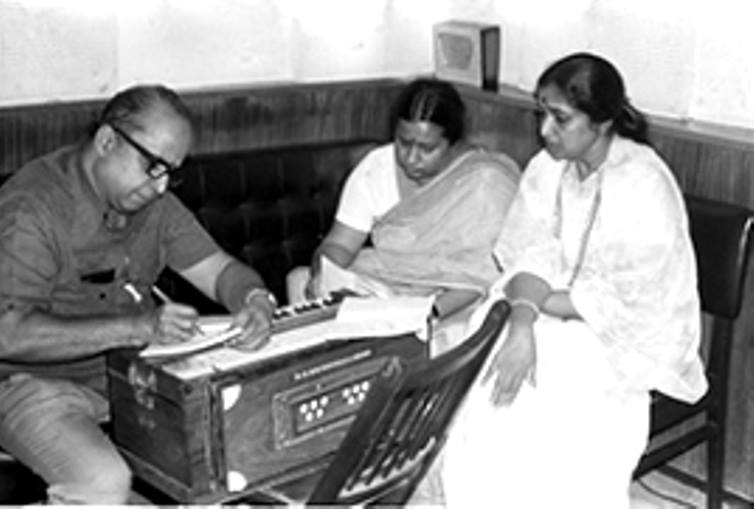 Asha with his daughter in the recording studio