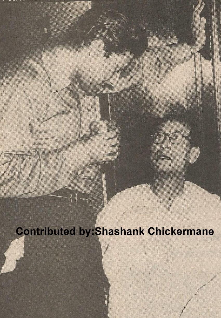 SD Burman discussing with Dev Anand in a party
